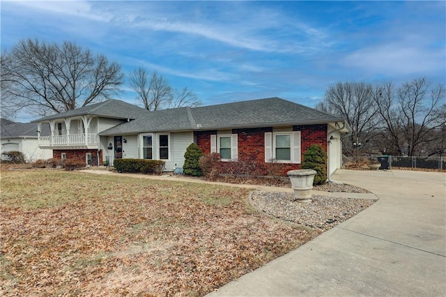 view of front of property featuring a garage and a front lawn