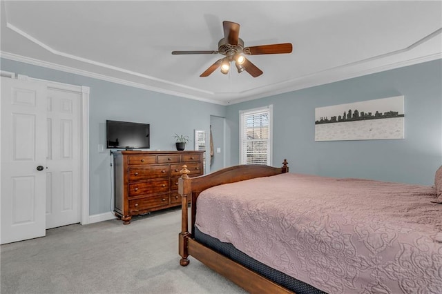 carpeted bedroom with baseboards, ornamental molding, and a ceiling fan