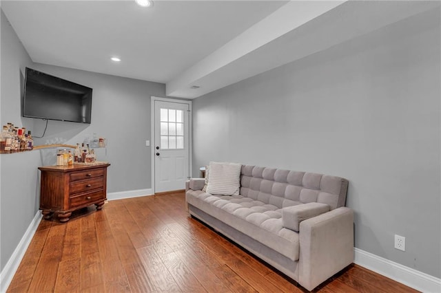 living room with hardwood / wood-style floors, recessed lighting, and baseboards