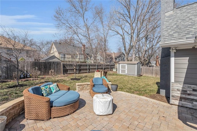 view of patio / terrace with an outdoor living space, a fenced backyard, a storage shed, and an outdoor structure