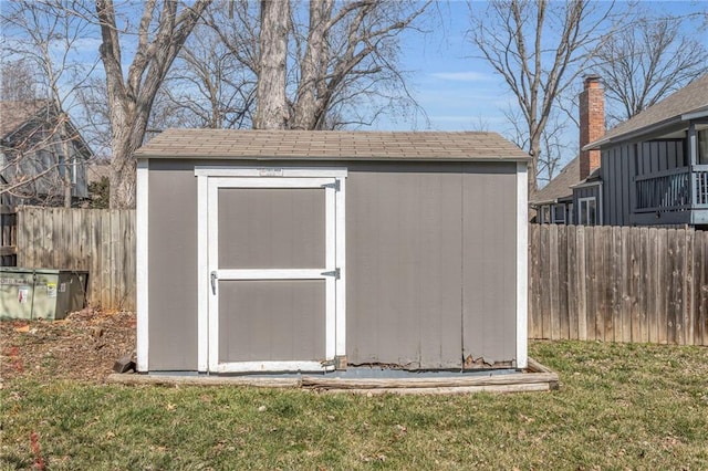 view of shed with fence