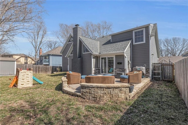 back of property featuring a fenced backyard, a playground, and a patio