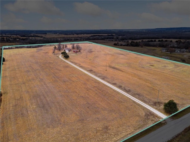 birds eye view of property featuring a rural view