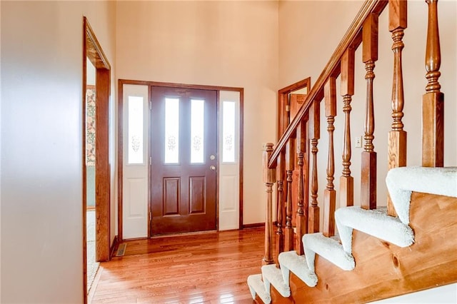 entrance foyer with light hardwood / wood-style floors