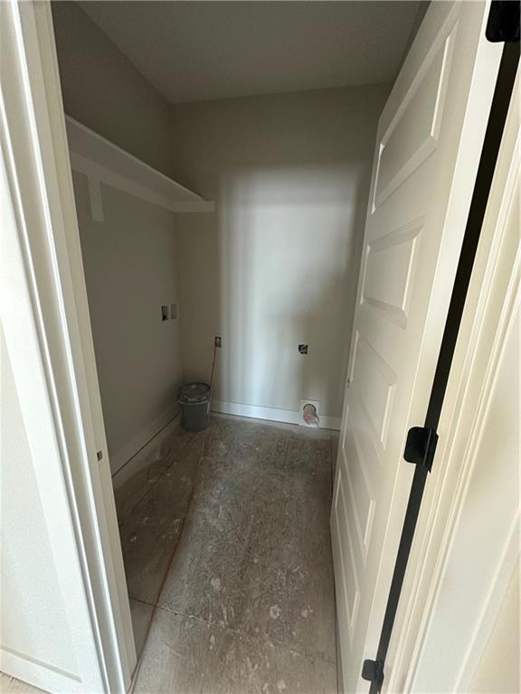 laundry room featuring laundry area and baseboards