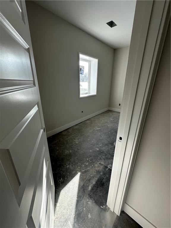 empty room with baseboards