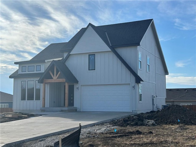 modern farmhouse style home with a garage and driveway