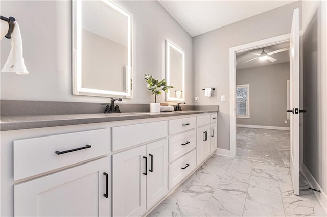 bathroom with ceiling fan and vanity