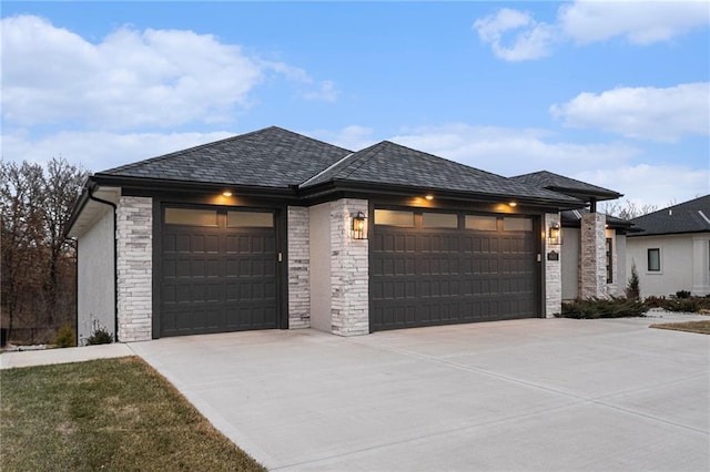 prairie-style home featuring a garage