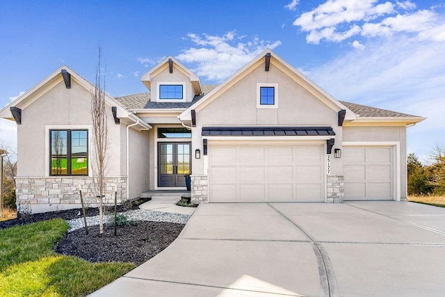 view of front of house with a garage and french doors