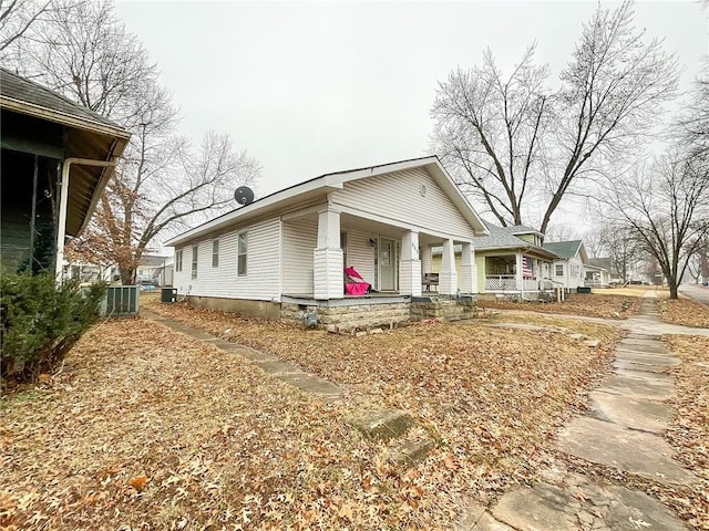 view of front of house featuring a porch and cooling unit