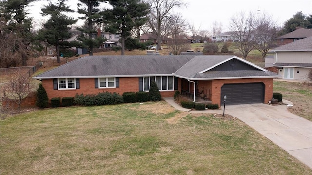 ranch-style house with a garage and a front yard