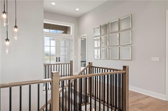 corridor with light hardwood / wood-style floors