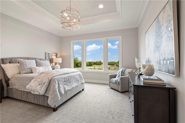 bedroom featuring light carpet, an inviting chandelier, and a tray ceiling