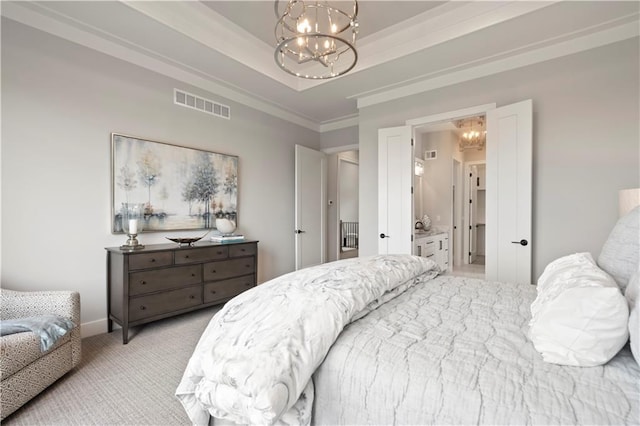 bedroom with crown molding, light colored carpet, a tray ceiling, and a chandelier