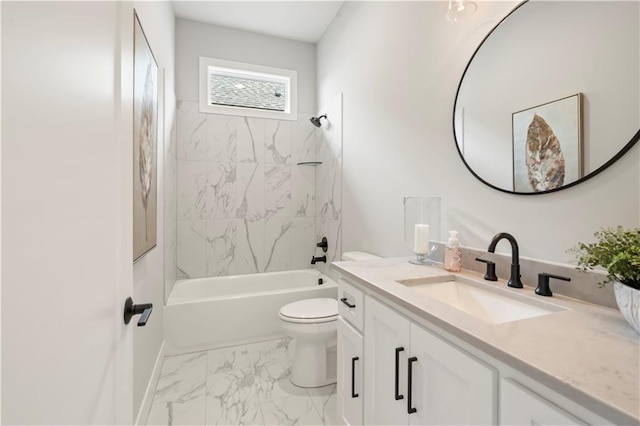 full bathroom featuring vanity, tiled shower / bath combo, and toilet