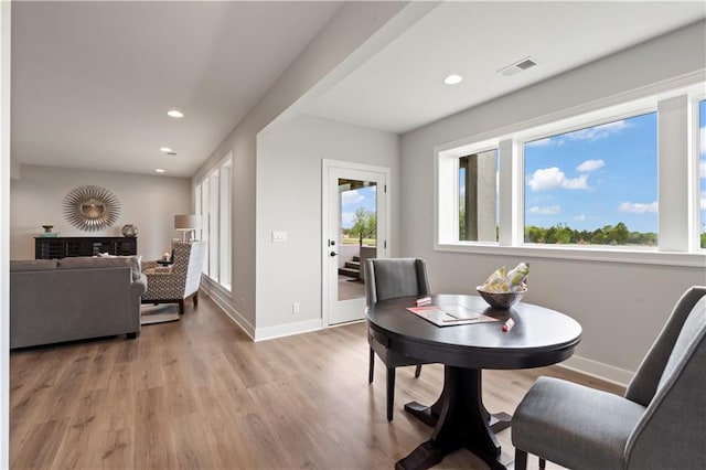 dining space with light wood-type flooring