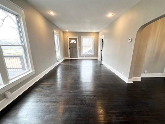 entrance foyer with dark hardwood / wood-style flooring