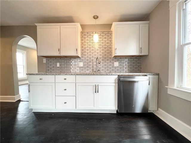 kitchen featuring white cabinetry, sink, pendant lighting, and dishwasher