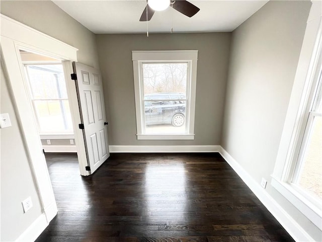 empty room featuring dark hardwood / wood-style floors and ceiling fan