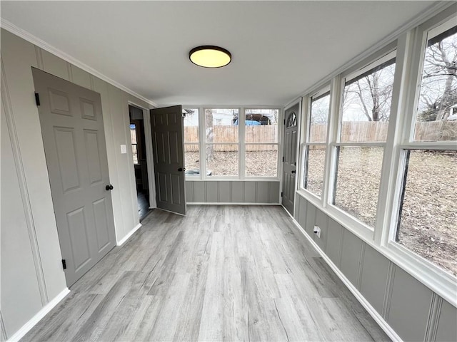 unfurnished sunroom with a healthy amount of sunlight