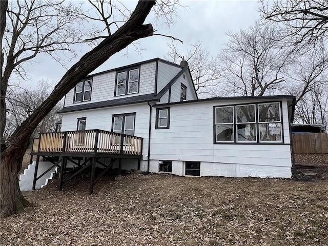 back of property with a wooden deck