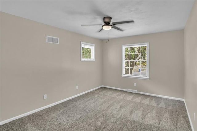 carpeted empty room with ceiling fan