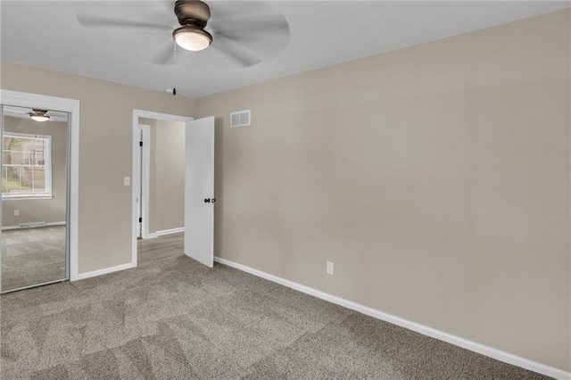 unfurnished bedroom with light carpet and ceiling fan