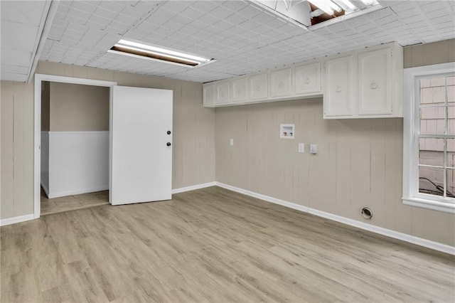 laundry room with light hardwood / wood-style flooring