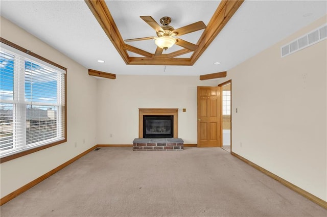 unfurnished living room with ceiling fan and light colored carpet