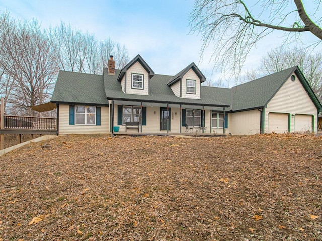 view of front of home with a garage and covered porch