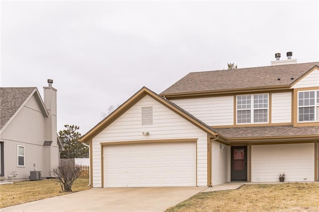 view of front of property featuring central AC and a front yard