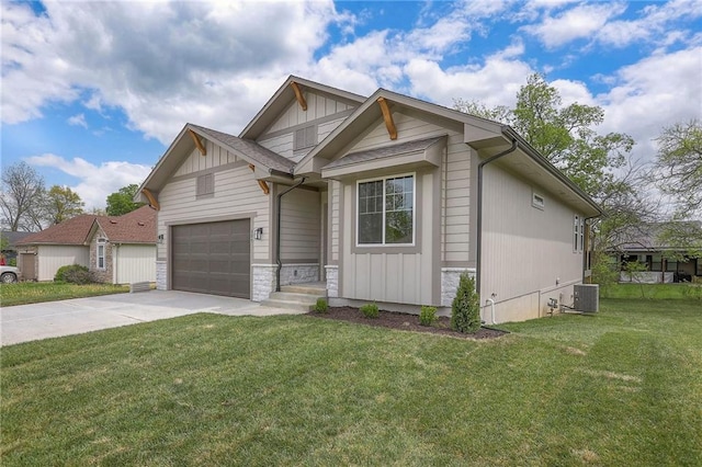 view of front of home with a front lawn, driveway, a garage, and board and batten siding