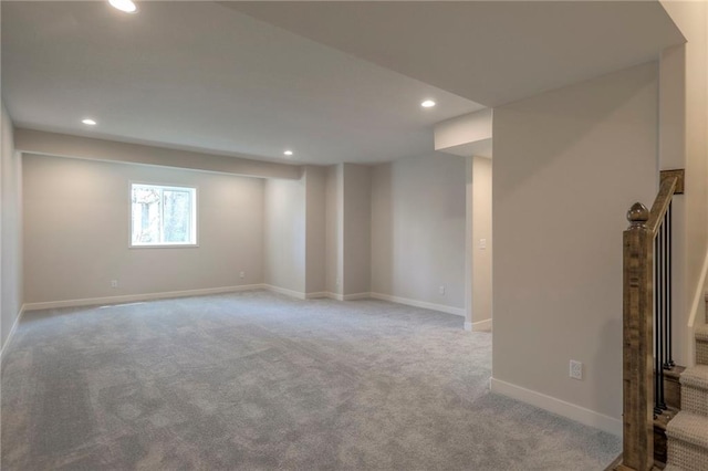 below grade area with recessed lighting, carpet flooring, and baseboards