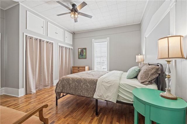 bedroom with light wood-type flooring and ceiling fan