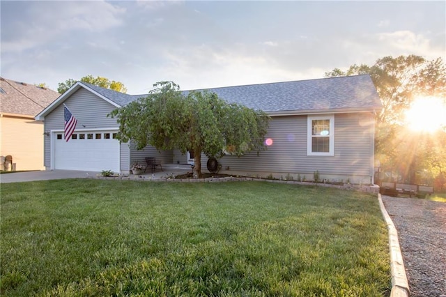 single story home with a garage and a front lawn