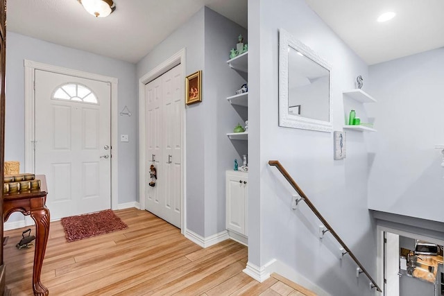 entryway with light hardwood / wood-style floors