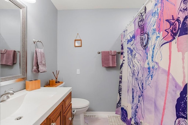 bathroom featuring tile patterned floors, toilet, a shower with shower curtain, and vanity