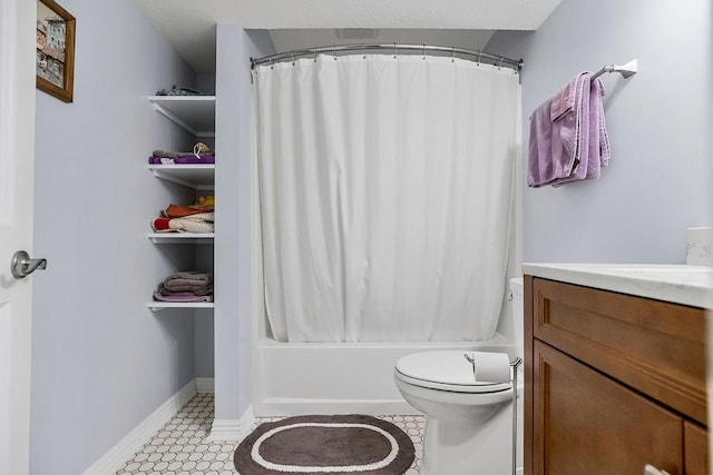 full bathroom featuring vanity, toilet, tile patterned flooring, and shower / bath combo