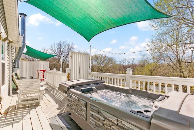 wooden terrace with a hot tub