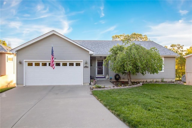 single story home with a garage and a front lawn