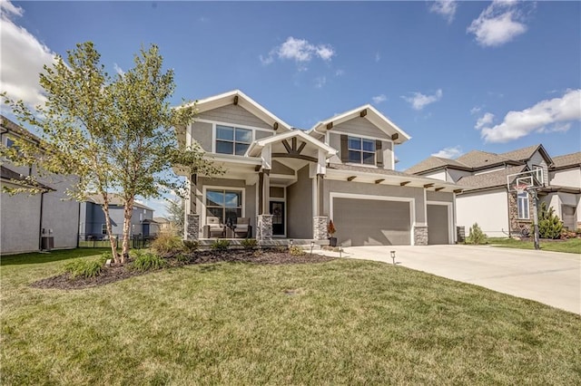 craftsman inspired home with a garage and a front yard