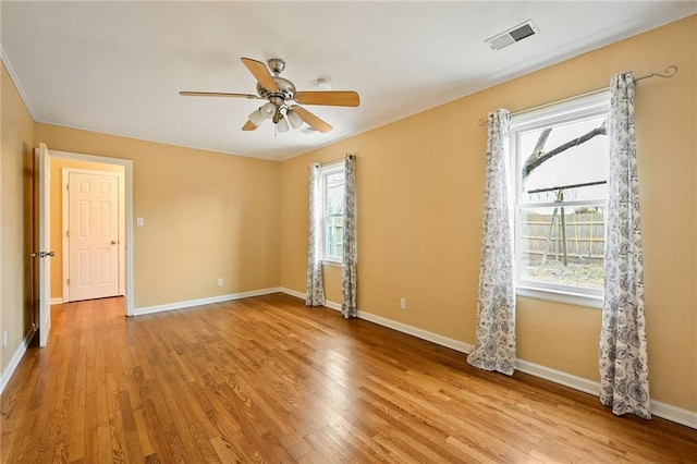 empty room featuring light hardwood / wood-style floors and ceiling fan