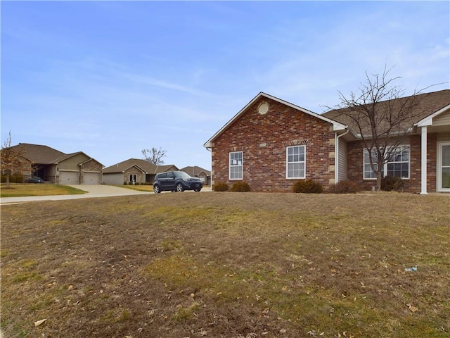 view of side of home featuring a lawn