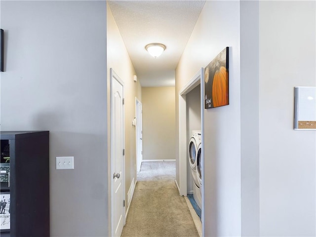 hallway featuring light carpet