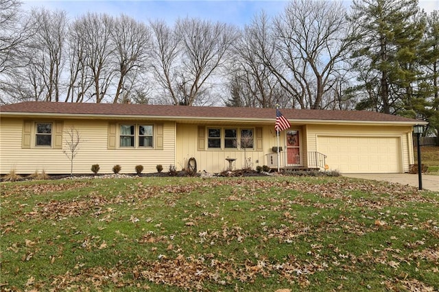 ranch-style house with a garage and a front yard