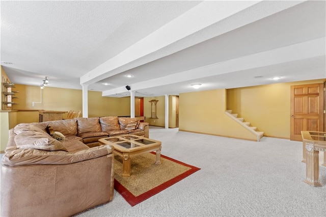 living room with carpet flooring and a textured ceiling