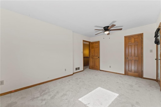 unfurnished bedroom with light carpet and ceiling fan