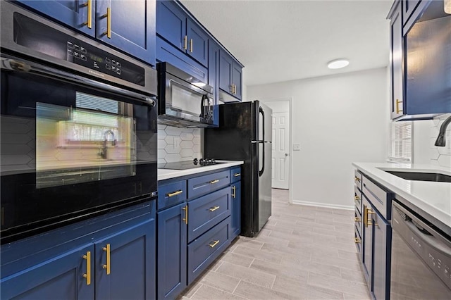 kitchen featuring sink, decorative backsplash, black appliances, and blue cabinetry