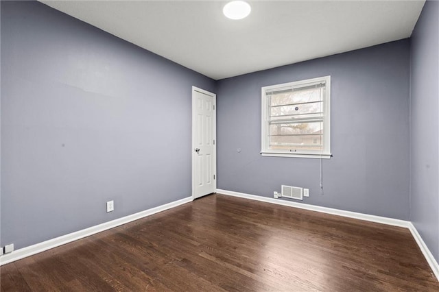 empty room featuring dark hardwood / wood-style floors